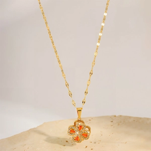 Elegant rotating four-leaf clover stainless steel necklace with sparkling zircon stones