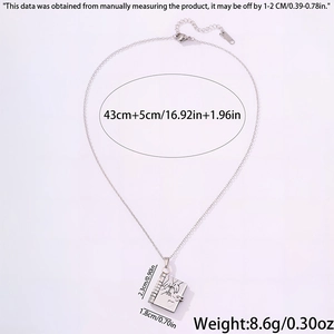 Detail of silver book pendant with pinky promise engraving and adjustable lobster clasp