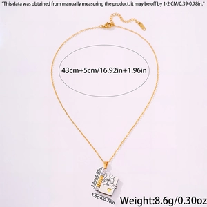 Detailed view of book-shaped titanium necklace pendant with heart and dimensions