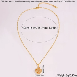 Detailed close-up of a gold rotating clover necklace with measurements and crystal inlay