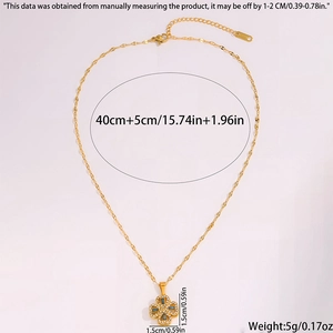 Detail showing the rotating four-leaf clover pendant with SS316L material tag and dimensions