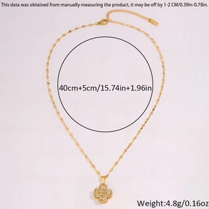 Close-up of golden four-leaf clover pendant necklace with 40cm plus 5cm chain length