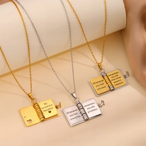 Book-shaped envelope pendant necklace in gold and silver with engraved daughter message