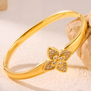 Elegant gold titanium steel clover bracelet with sparkling rhinestones for women