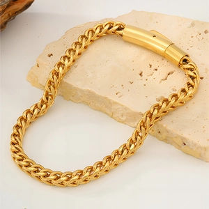 Gold-plated stainless steel wheat chain bracelet with cylindrical clasp on stone