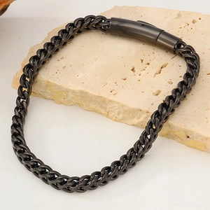 Detail of black titanium steel dragon bone chain bracelet with cylindrical pressure clasp