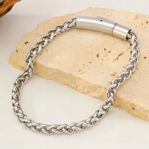 Close-up of titanium steel wheat chain bracelet with polished cylindrical clasp