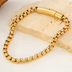 Minimalist gold-tone titanium steel box chain bracelet with high-polish finish on stone