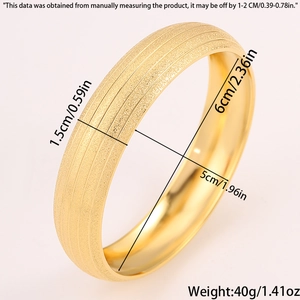 Macro shot of gold matte titanium steel bangle showing 1.5cm width and sand texture