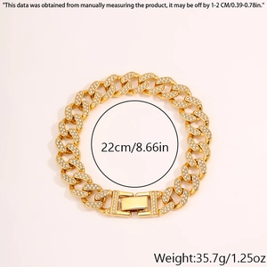 Detalle de pulsera cubana dorada con pedrería incluyendo medida 22cm e información de peso