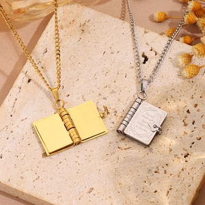 Vintage stainless steel book locket necklaces in gold and silver with floral engravings