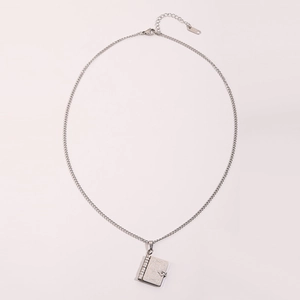 Close-up of vintage steel book pendant necklace with adjustable chain and S925 clasp