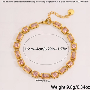 Detailed view of gold plated stainless steel bracelet with pink crystals and lobster clasp