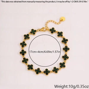 Detail view of gold clover bracelet with green zircons showing dimensions and 10g weight