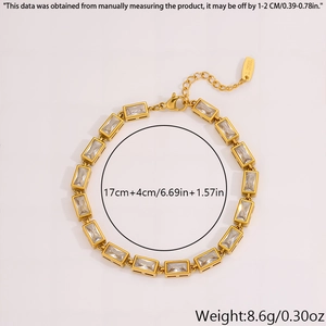 Close-up of gold stainless steel bracelet featuring rectangular clear zircons and lobster clasp