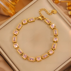 Luxury gold stainless steel bracelet with pink zircon stones in a leather jewelry box