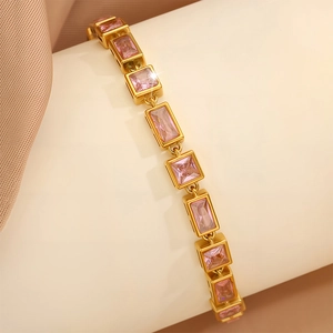 Macro shot of 18K gold plated bracelet with square and rectangular pink zircons