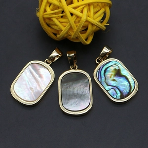 Three natural shell rectangular pendants with gold plated borders and colorful iridescent glow