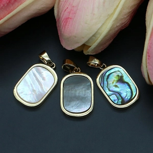 Rectangle natural sea shell pendants with gold plated edges and sparkling diamond inlay