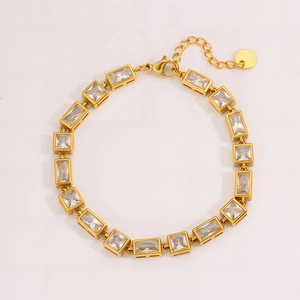 Macro shot of gold stainless steel bracelet with rectangular cubic zirconia and lobster clasp