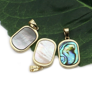 Rectangle shell pendants in black, white, and rainbow shell with gold plated edges