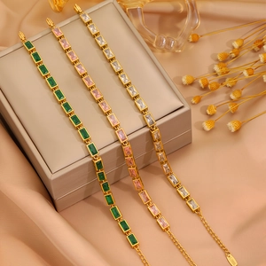 Elegant stainless steel gold bracelets with colorful cubic zirconia on jewelry box