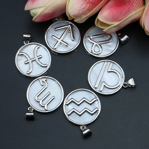 Natural white shell zodiac pendants with silver frames and various astrological signs