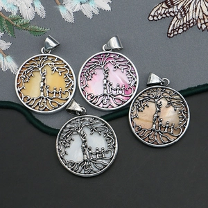 Set of four vintage life tree round shell pendants with natural pearl luster details