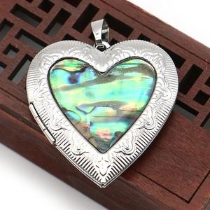 Vintage heart-shaped locket pendant with natural abalone shell and silver floral engraving