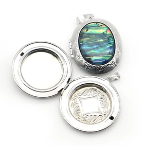 Engraved silver oval locket with colorful abalone shell inlay for photos
