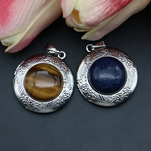 Vintage round locket pendants with tiger eye and lapis lazuli in floral engraved silver