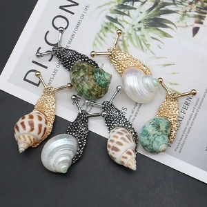 Set of natural shell snail brooches in gold and silver plating with vibrant textures