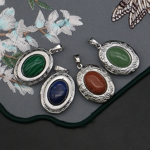 Locket pendants with natural stone inlay and floral embossed patterns on silver base