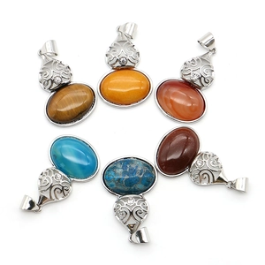 Set of six oval natural stone pendants with ornate silver-tone filigree and rhinestones