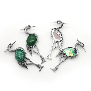 Crane-shaped vintage silver brooches with malachite and abalone shell inlays
