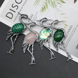 Vintage crane brooches set with natural rose quartz and abalone shell in silver finish