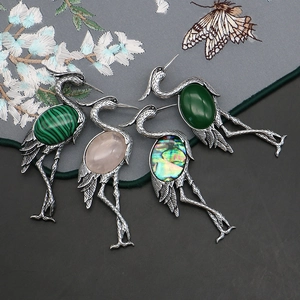 Vintage silver crane brooch set with natural rose quartz and abalone shell inlays