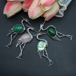 Vintage crane-shaped brooch with natural stone and abalone shell in silver finish