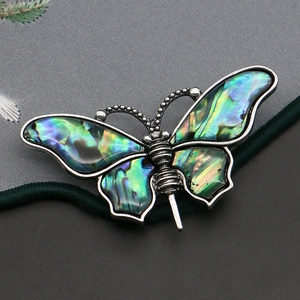 Iridescent abalone shell butterfly brooch and pendant in antique silver setting