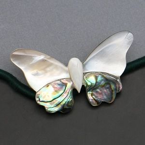 Natural butterfly shell brooch crafted from iridescent abalone and white mother of pearl