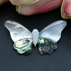 Elegant butterfly brooch crafted from natural white mother of pearl and abalone shell