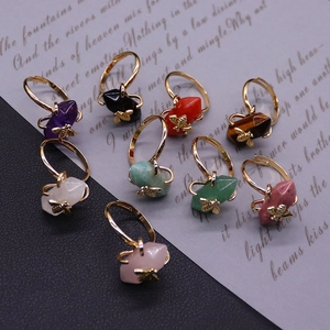 Set of eight natural stone hexagonal pillar rings with golden bee accents and thin bands