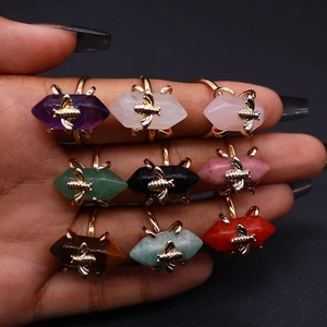 Bee-themed natural stone ring set featuring hexagonal crystal columns in golden metal