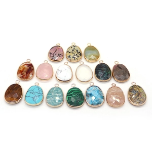 Collection of teardrop natural stone pendants with gold plated edges and circular loops