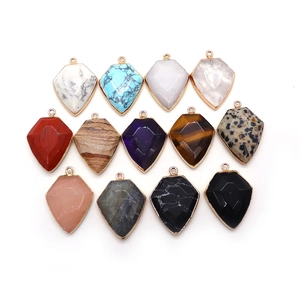Set of shield-shaped natural stone pendants with faceted cut and gold plated edges
