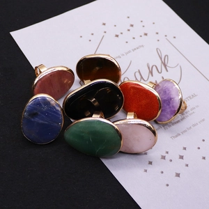 Adjustable gold rings with irregular natural stones in blue, green, and pink colors