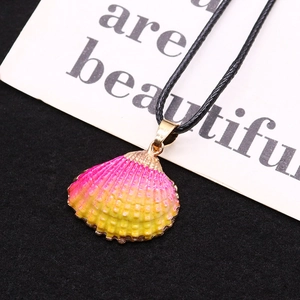Natural seashell pendant with pink yellow gradient and gold plated edges on black cord