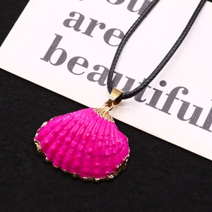 Pink sea shell pendant necklace with gold plated edge on black woven cord