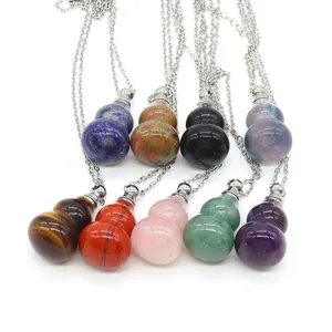 Macro detail of various natural gemstone perfume bottle pendants with silver chains