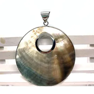 Natural black shell round hollow pendant with silver metal rim and iridescent luster